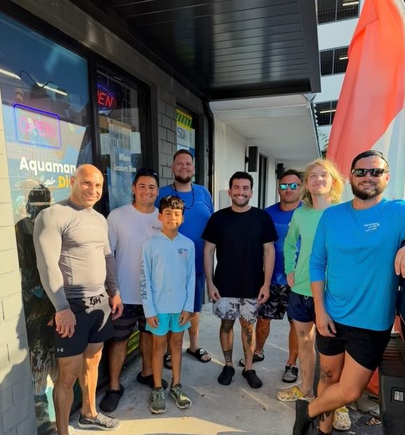 The Aquaman Dive Club crew outside the shop before the dive